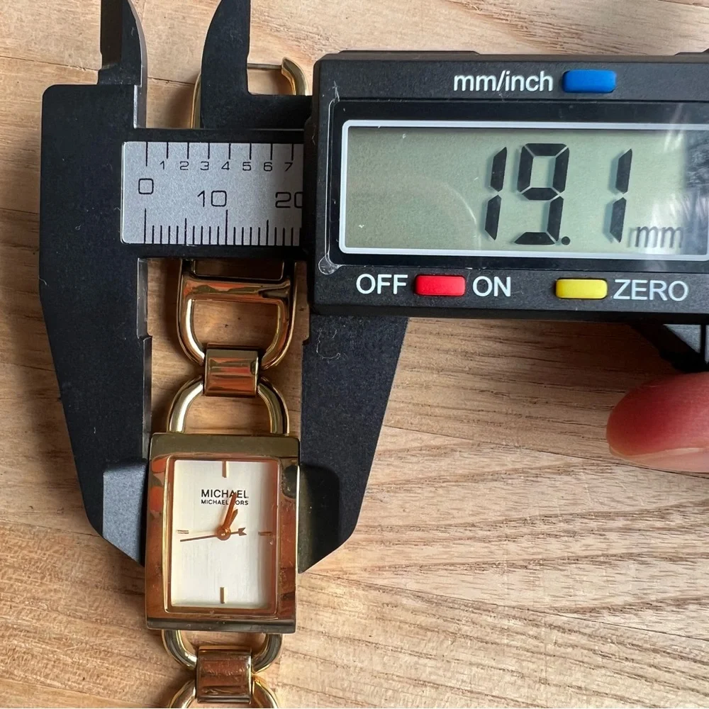 Michael Kors ladies rectangular gold tone bracelet dress watch NEW BATTERY